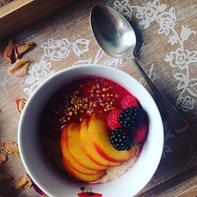 Almond milk porridge topped with what it's best this summer: crushed raspberries, juicy peaches, blackberries and not forgetting some bee pollen for added vitamins. #healthybreakfast #theorganiccookery